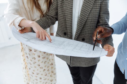 A real estate agent shows an empty property to potential buyers in a modern style.