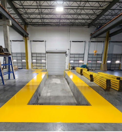 Commercial remodeling in Houston TX showing industrial warehouse space with loading dock and structural improvements